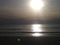 The green orb is the one that follows a man for over half an hour. Go to the pic tab and see the other photos of the orb and track it as it moves from over the sand to over the water.